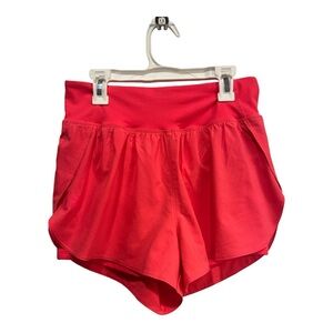 Under Armour Running/jogging shorts.  Size medium. Coral color